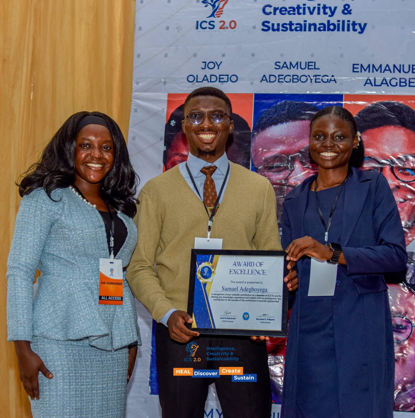 Samuel Adegboyega receiving the ICS 2.0 Award of Excellence