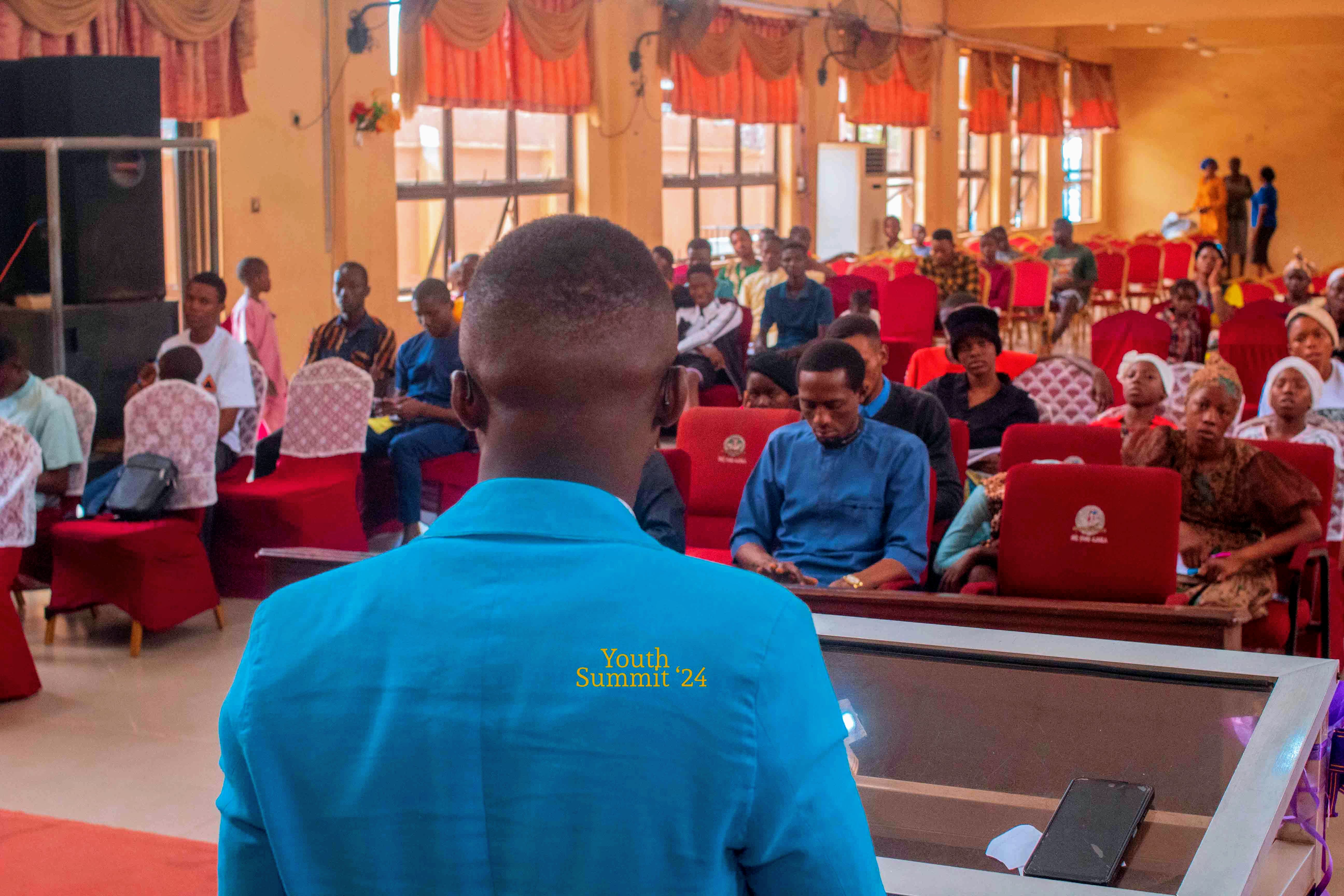 Samuel Adegboyega speaking at Youth Summit 2024